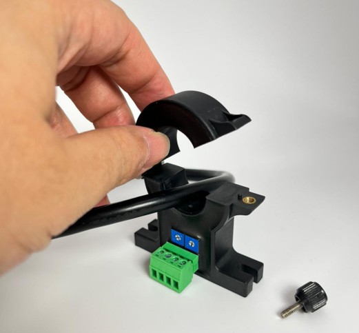 Demonstration of installing the CYHCT-L21K split-core current transducer by clipping it around an existing cable.