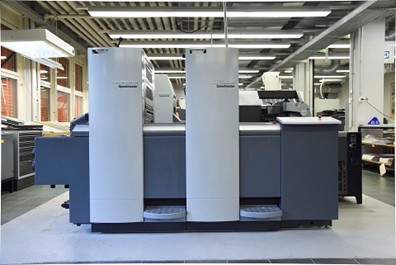 Offset printing machine illustrating an industrial application of vane sensors for speed and phase feedback.